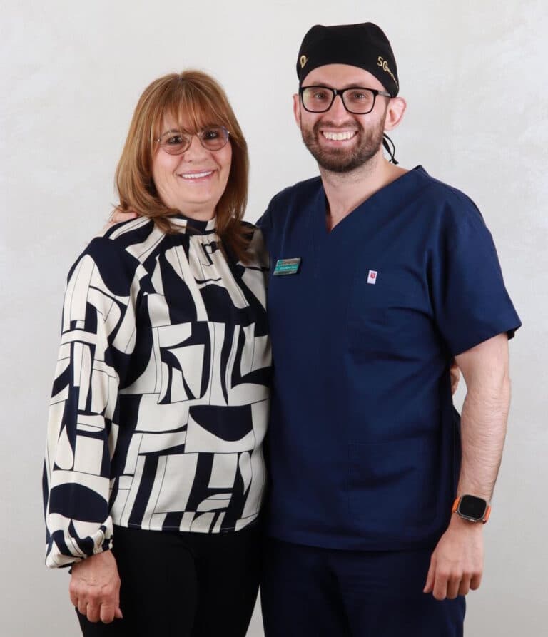 Dr. Alexandru Ciucu, alongside the patient with fixed teeth (All-on-4, All-on-6)